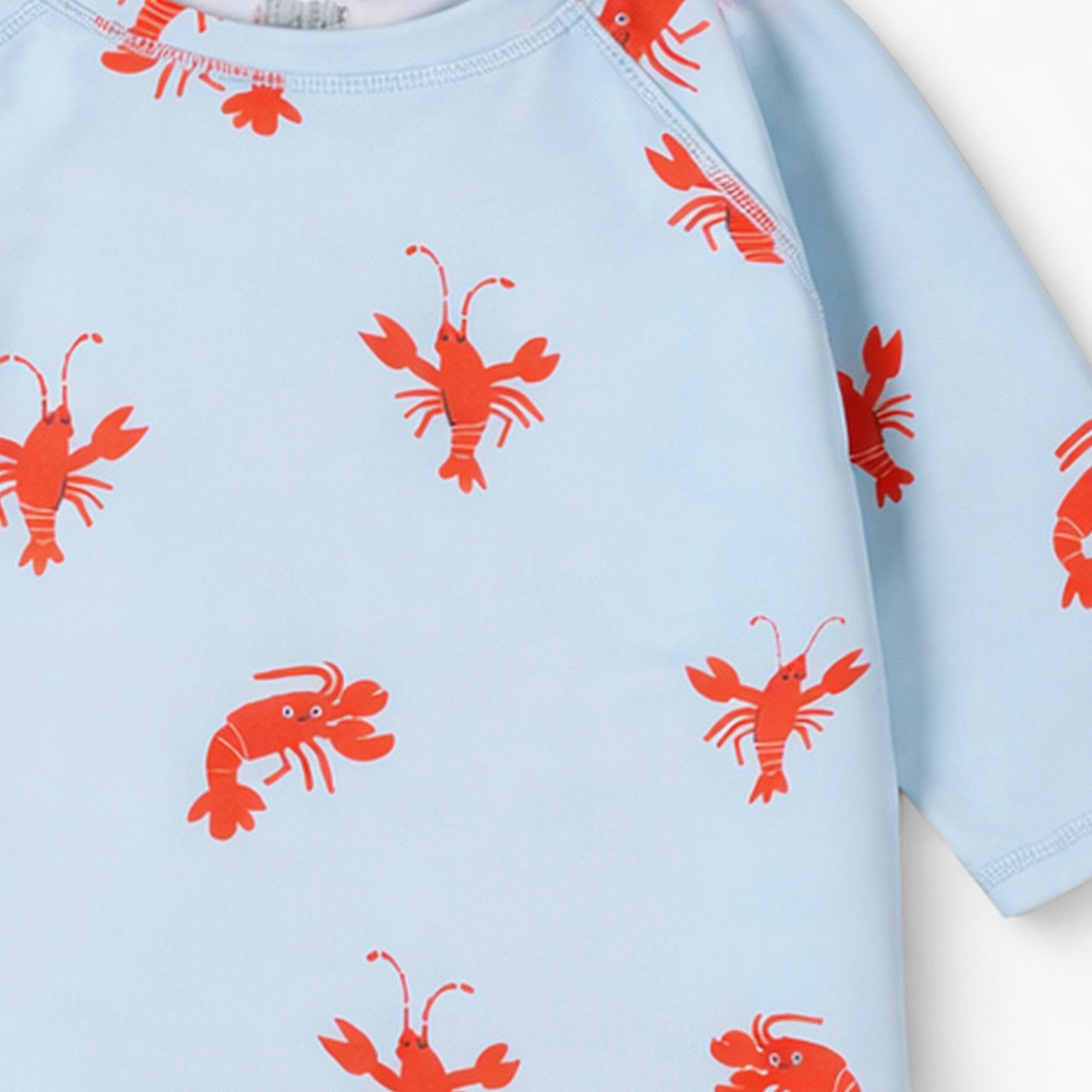 Zoom détails du t-shirt de bain bleu pâle à motifs de homards, enfant 