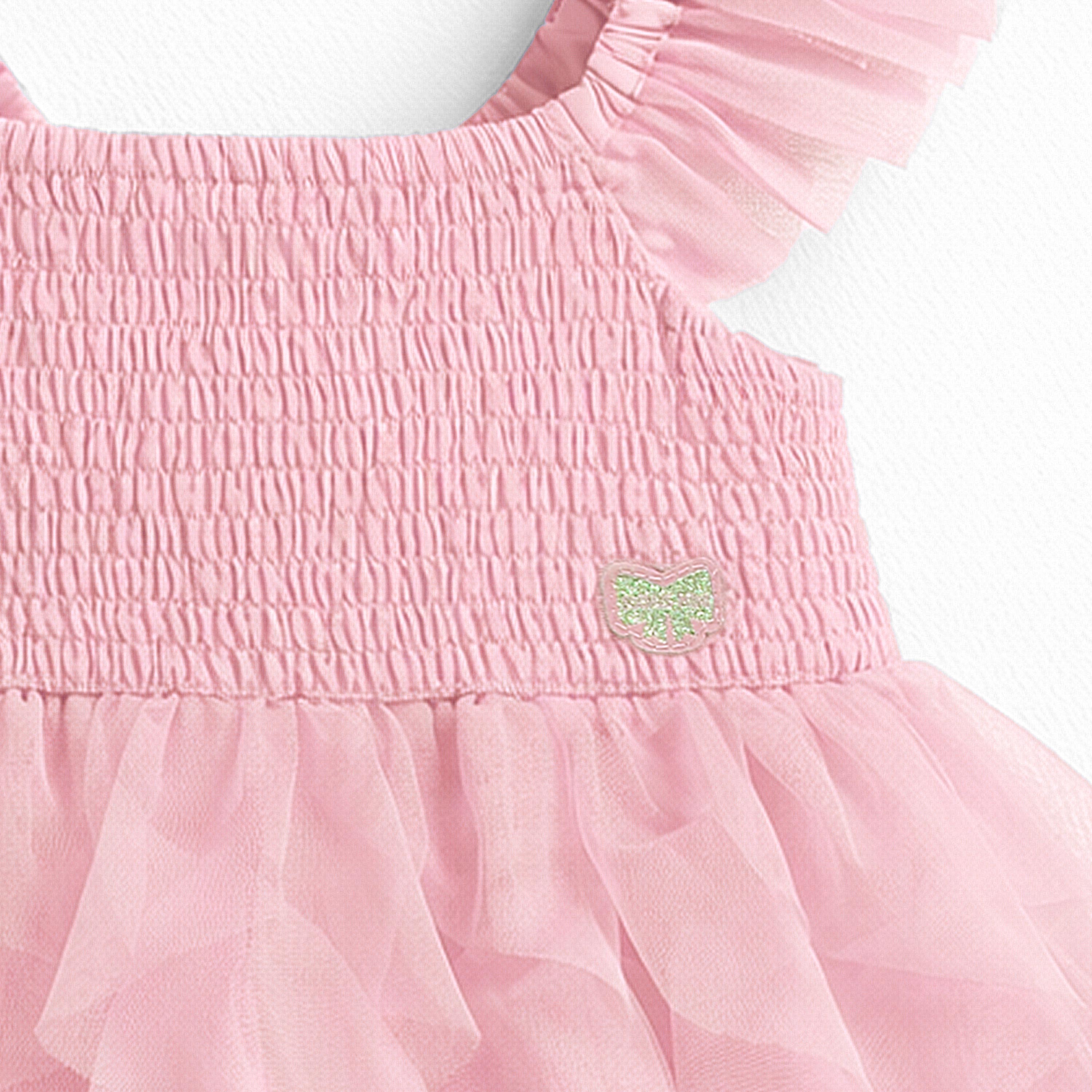 Zoom détails nid abeille robe rose en tulle souple, bébé 