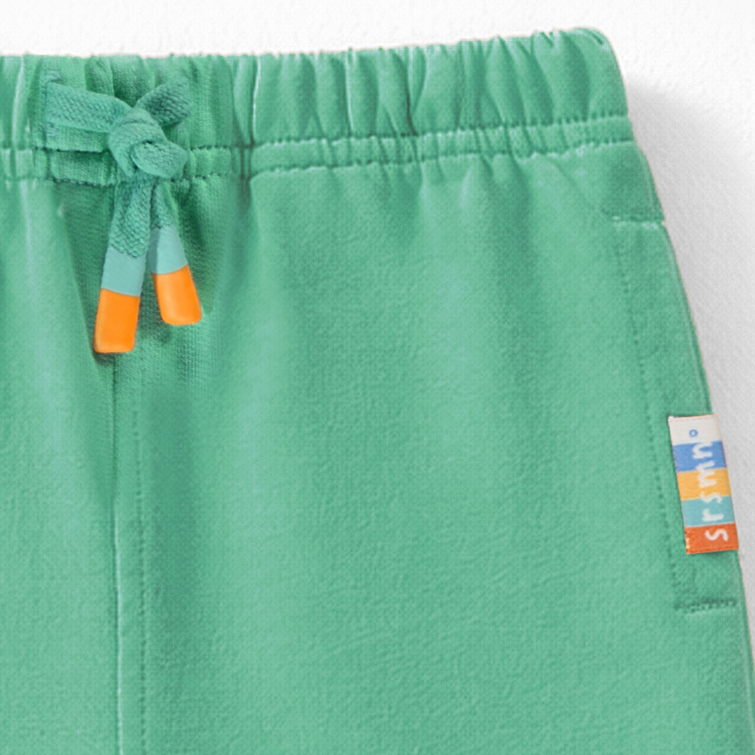 Zoom détails du pantalon turquoise style jogger, bébé