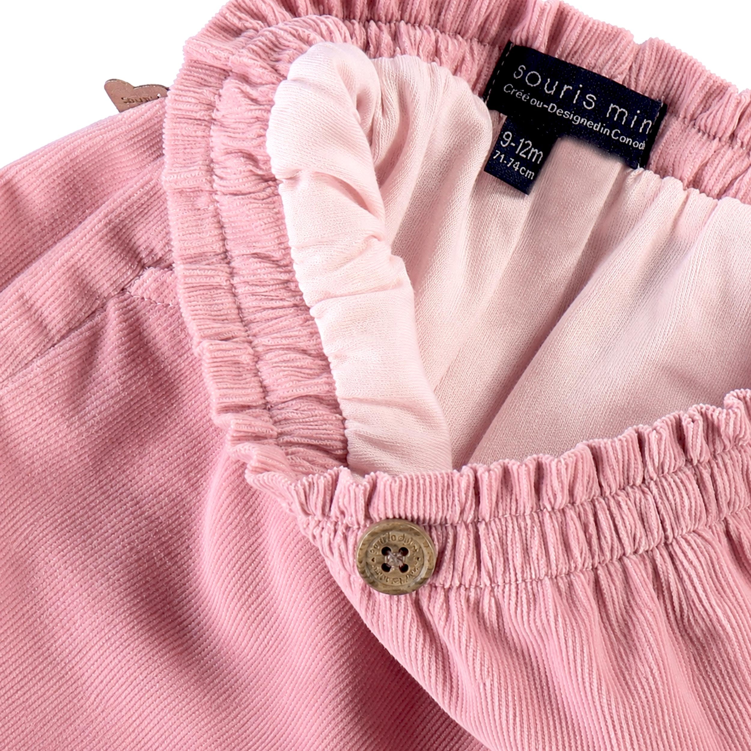 Zoom du pantalon en velours côtelé rose, bébé 