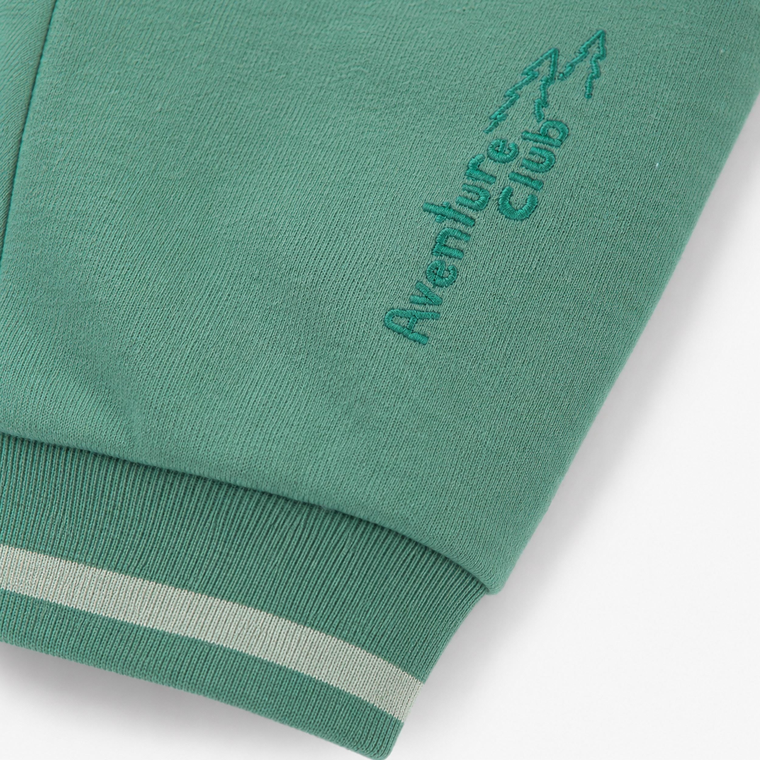 Zoom détails du pantalon vert en coton ouaté, enfant