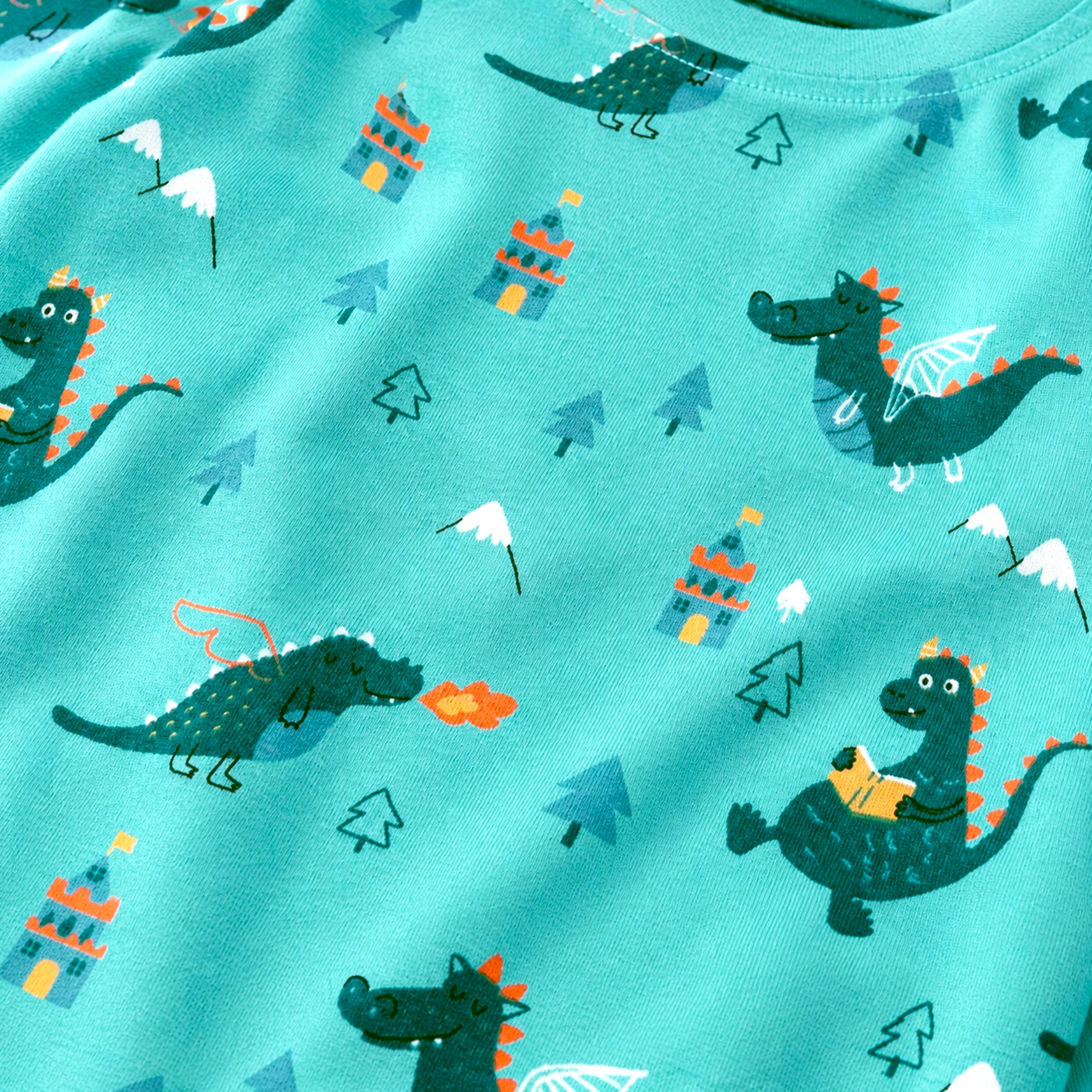 Zoom détails du pyjama deux pièces turquoise à imprimé de dragons, bébé 