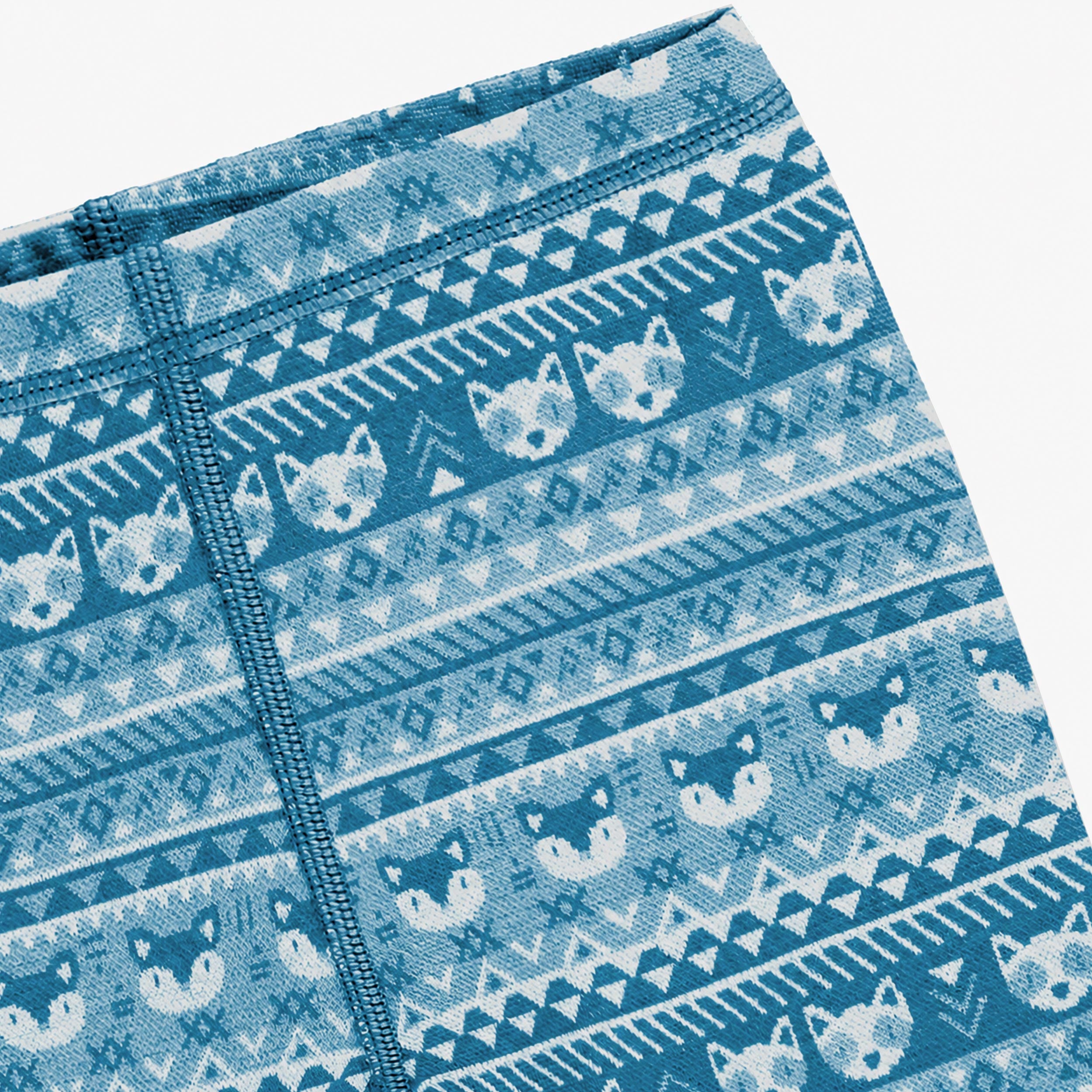 Détail des motifs du legging bleu en laine mérinos pour bébé