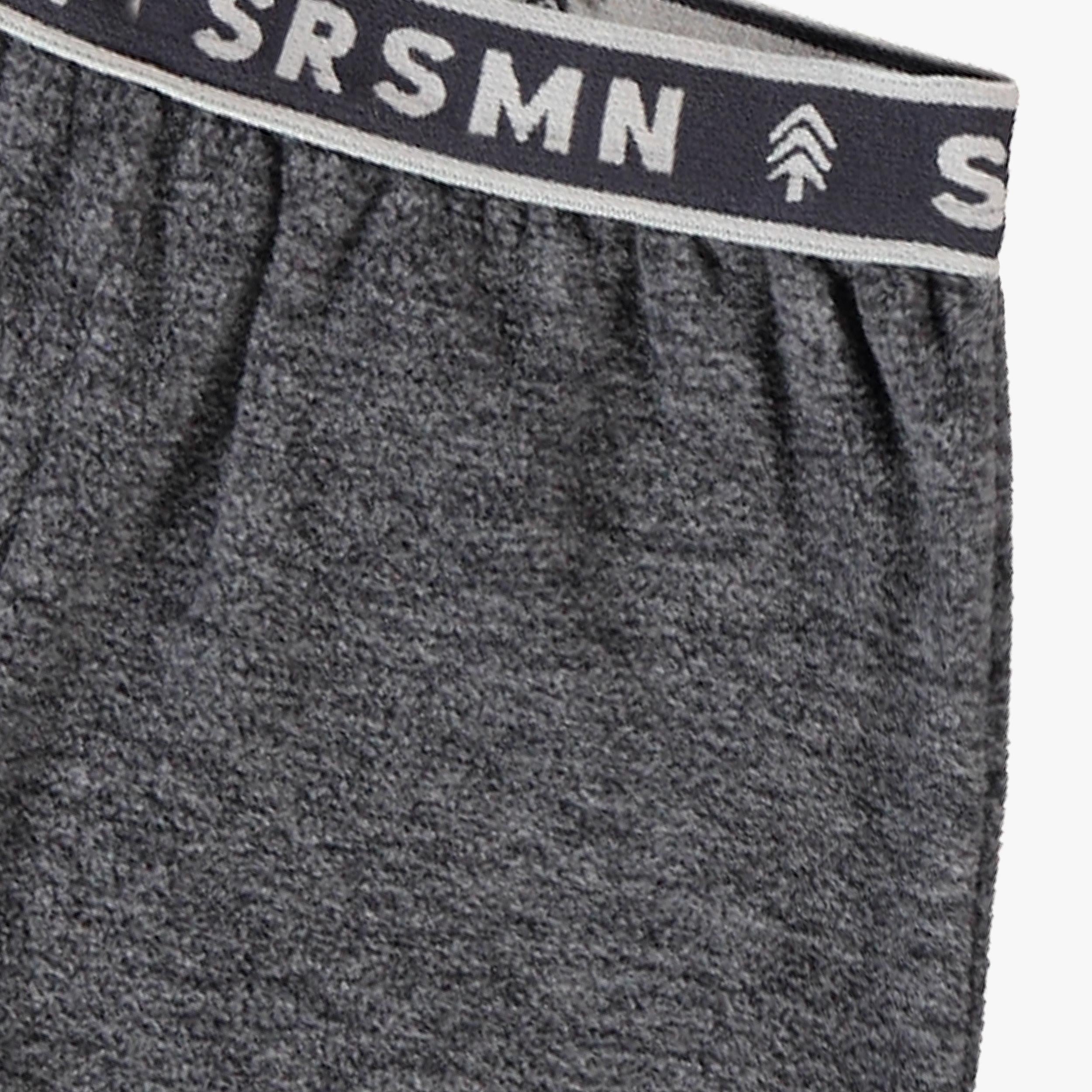 Détail du pantalon gris en polar pour bébé Souris Mini avec taille élastique, tissu doux et chaud.