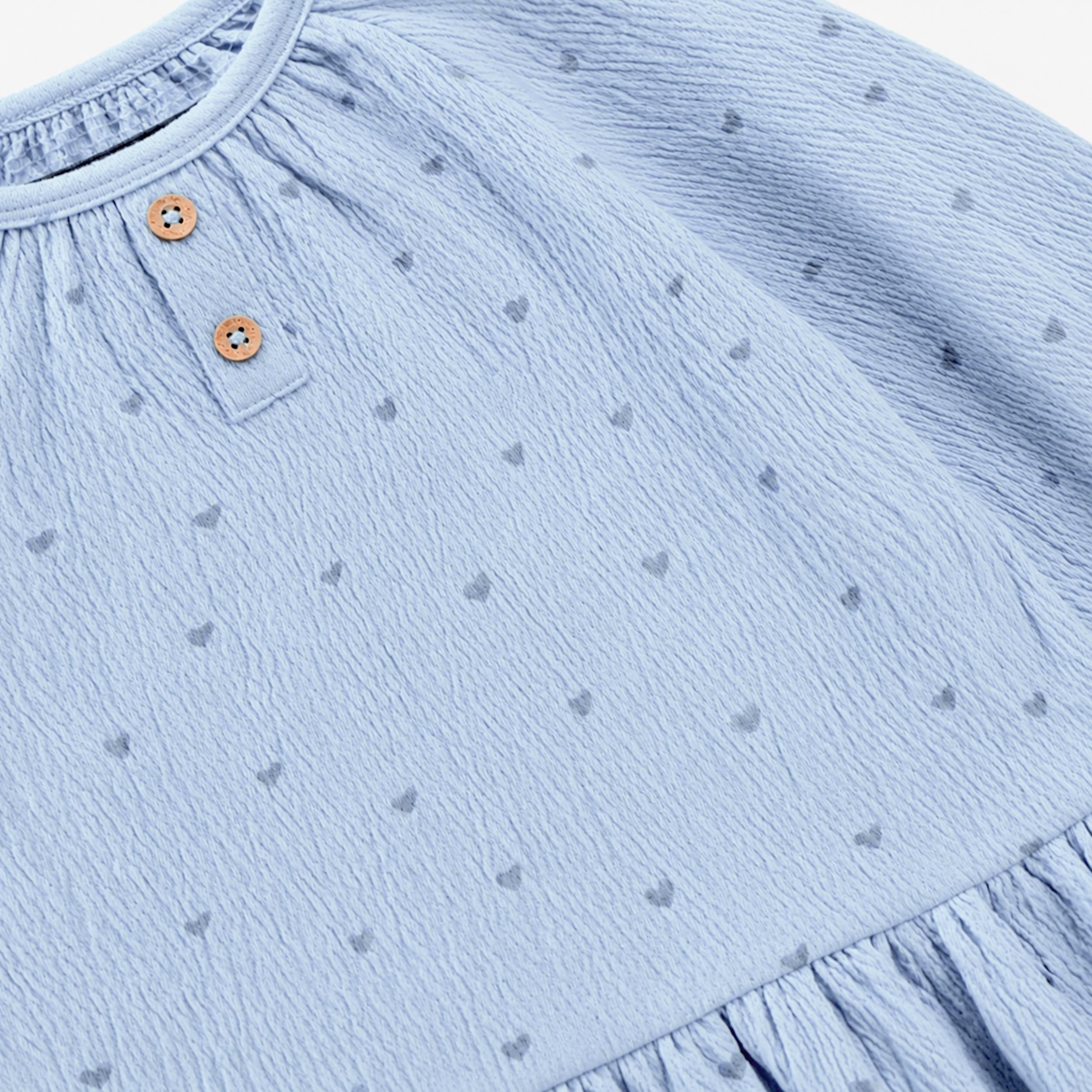 Zoom de la robe bleue en jersey crêpé à imprimés, bébé 