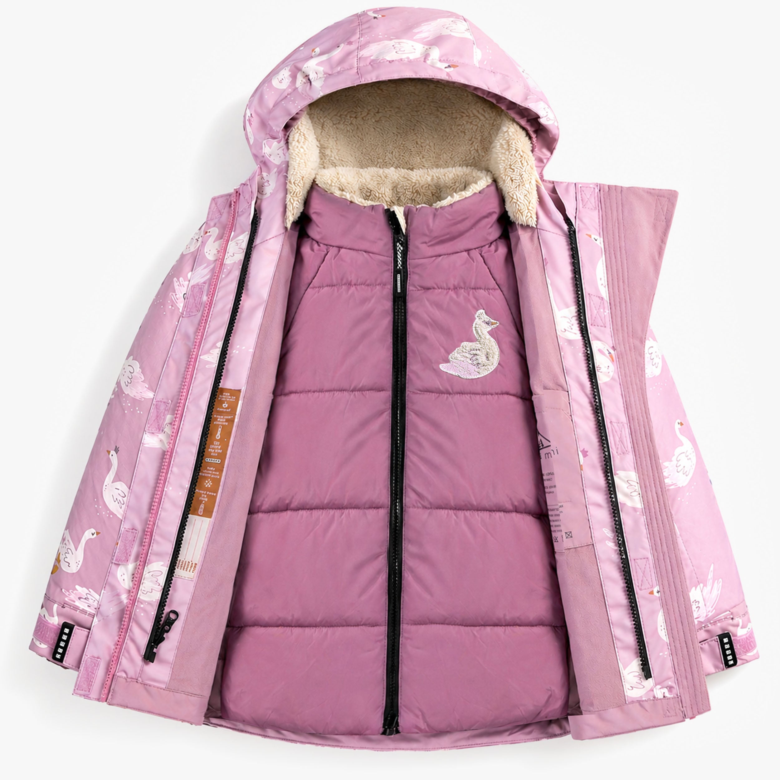 Manteau de neige 3-en-1 pour enfant ouvert avec imprimé cygnes roses, montrant la veste matelassée intérieure amovible et la doublure chaude pour l’hiver.