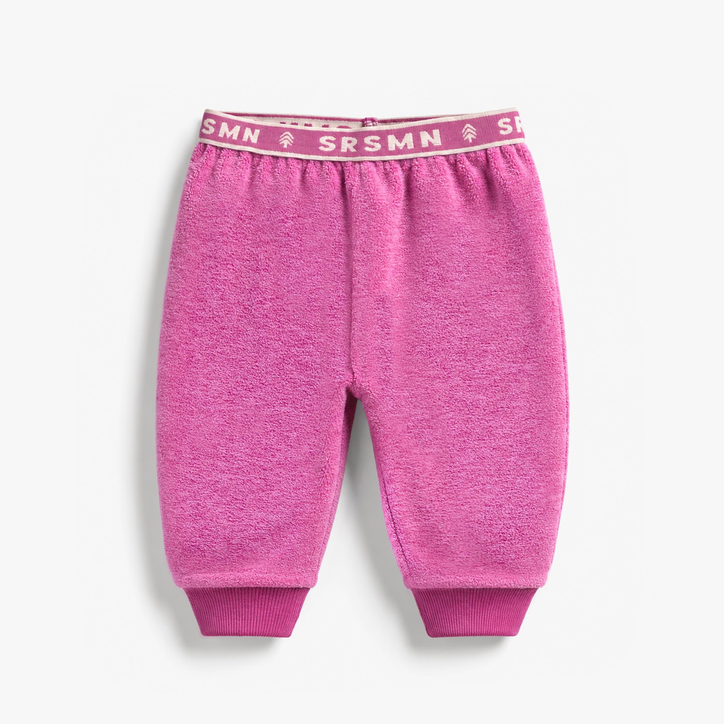 Pantalon mauve en polar pour bébé avec taille élastique et chevilles en tricot côtelé.