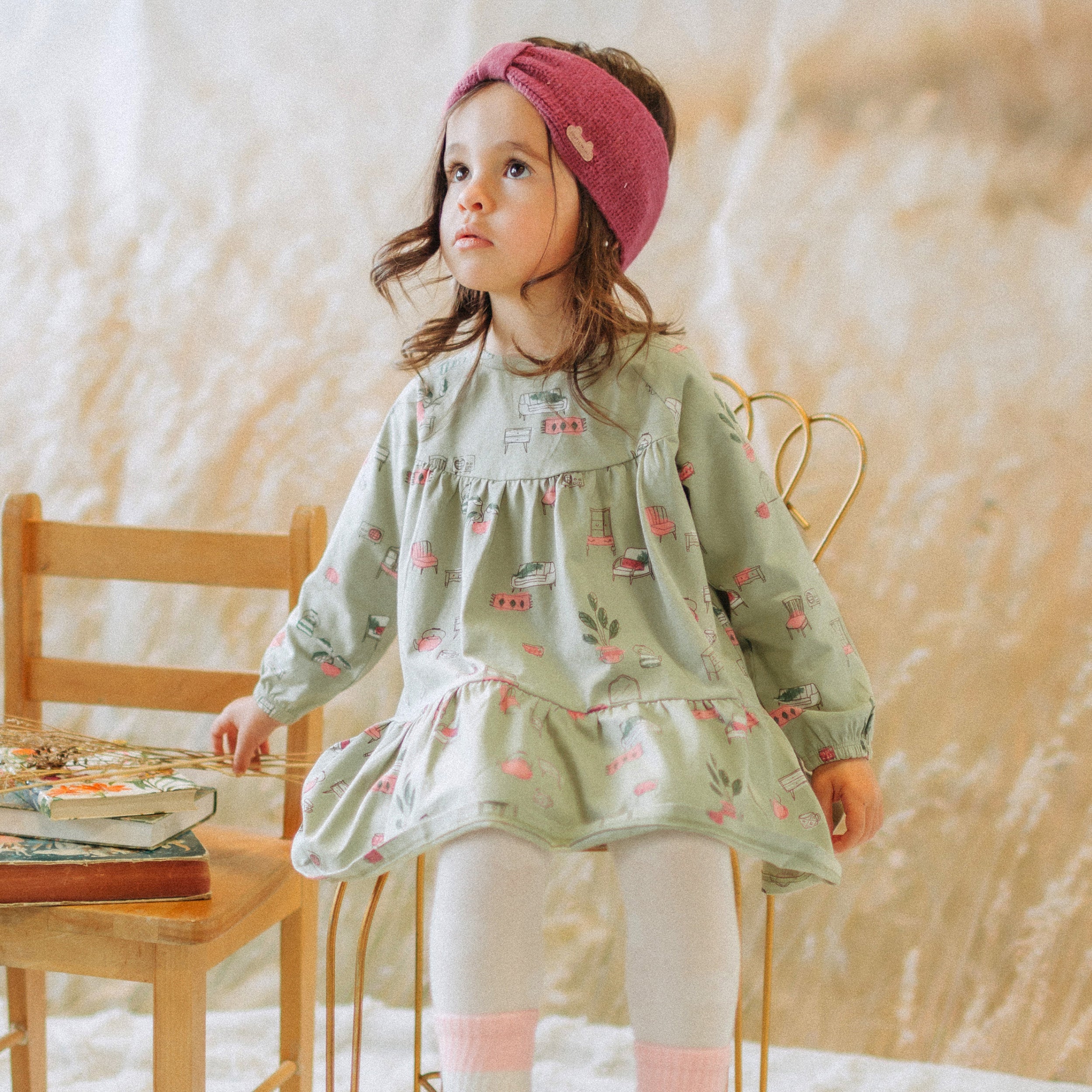 Sage green dress with illustrations of antique furniture in jersey, baby