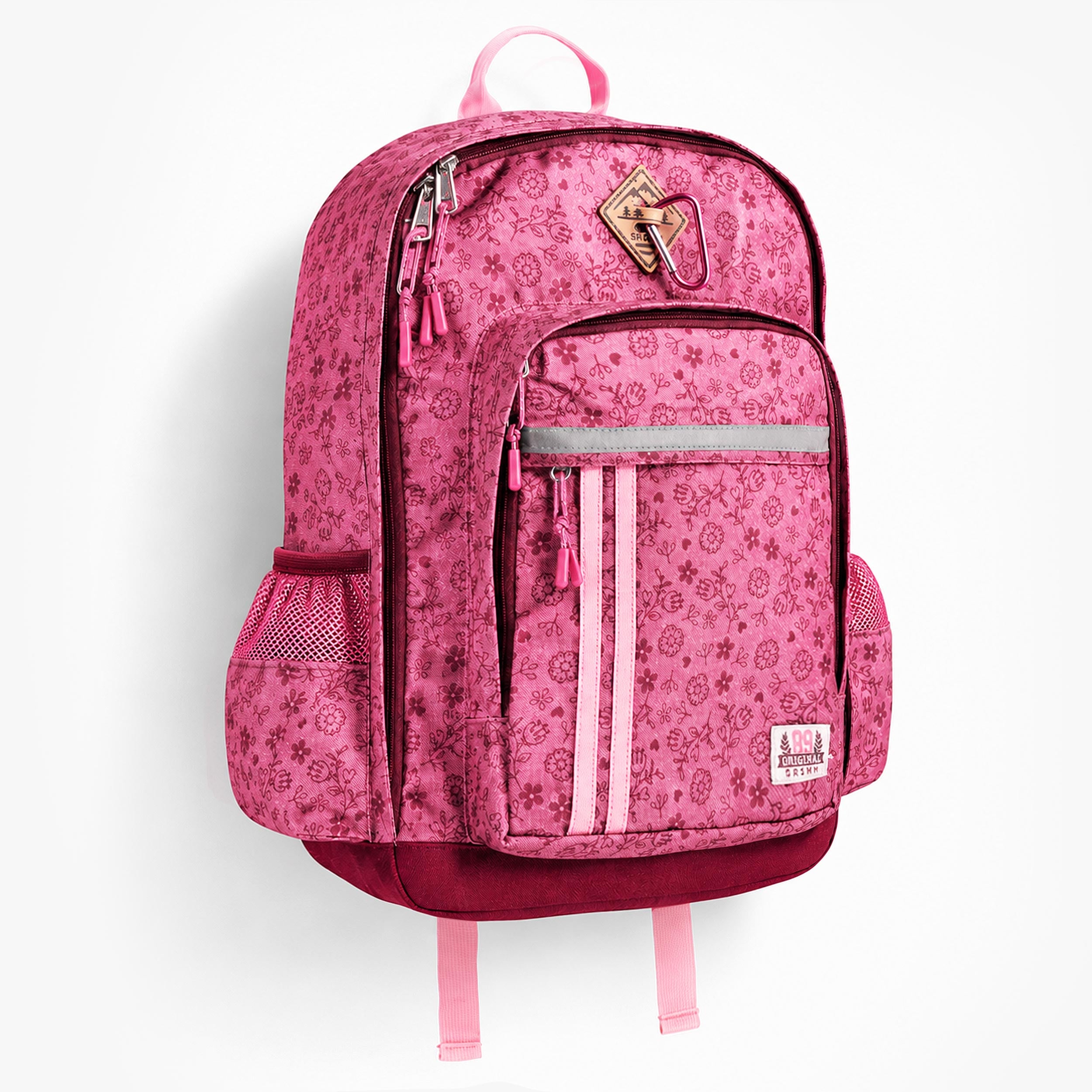 Sac à dos enfant rose à motif floral vu de face avec plusieurs poches zippées et compartiments de rangement.