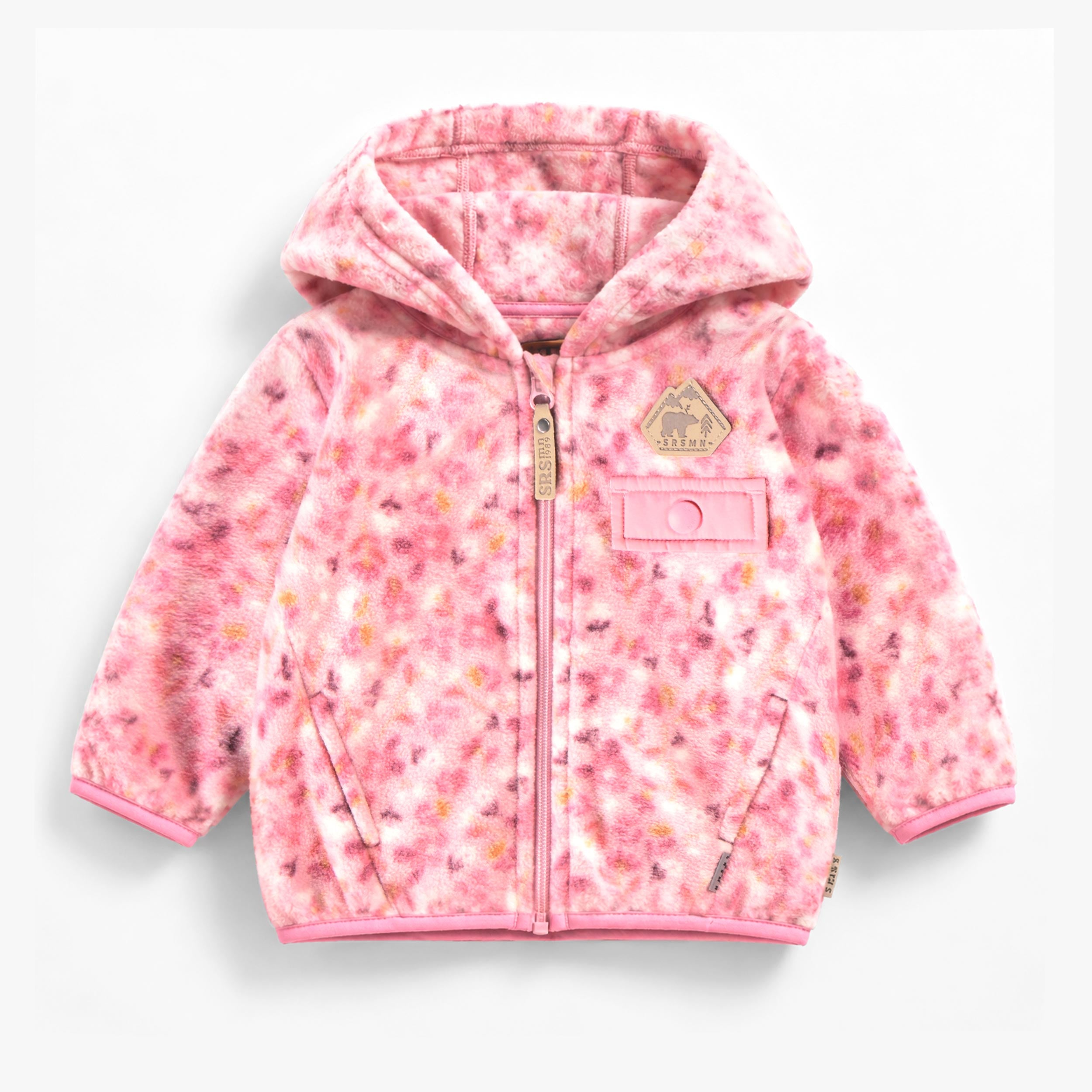 Veste rose en polar à imprimé floral pour bébé avec capuchon, fermeture éclair et poches.